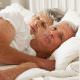 older couple laying in bed